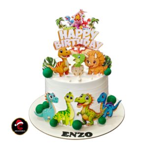 Dinosaur theme birthday cake with cute dinosaur decorations by CArol Cakes & Cafe Mararikulam