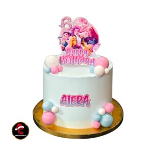 K-Pop Demon Hunters theme vanilla birthday cake with pink and blue decorations by Carol Cakes & Cafe Mararikulam